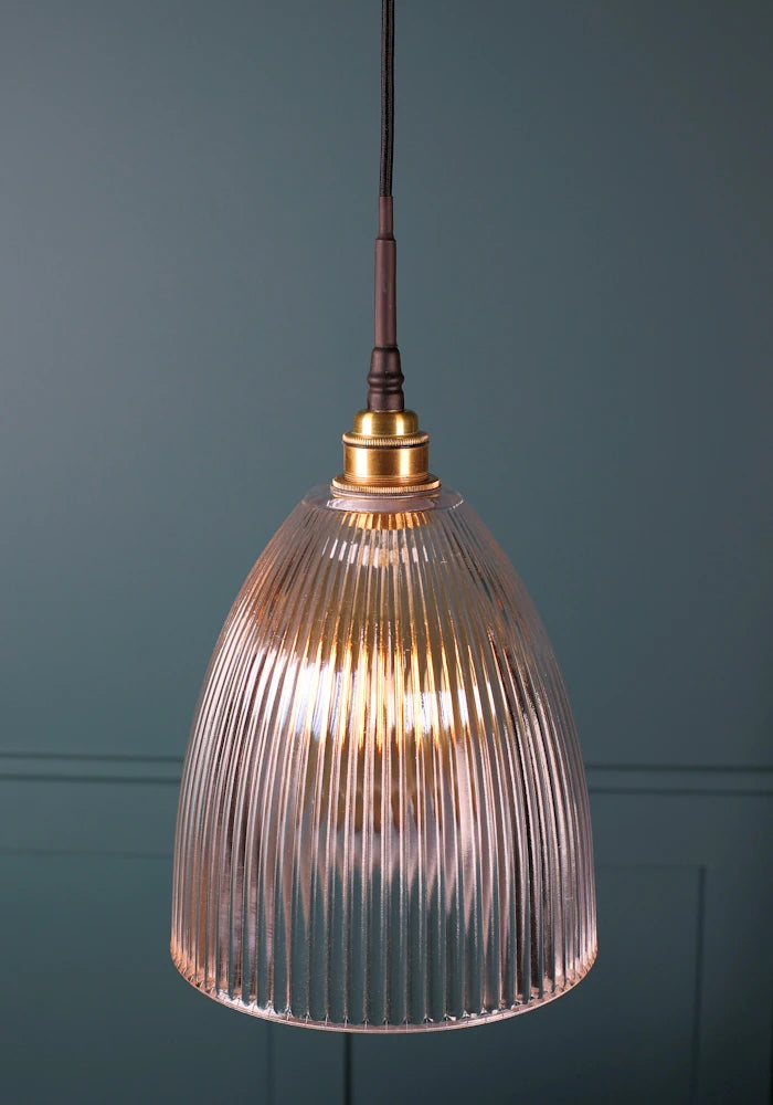 Medium sized ribbed glass bathroom pendant light with brushed brass lamp holder and black fabric flex