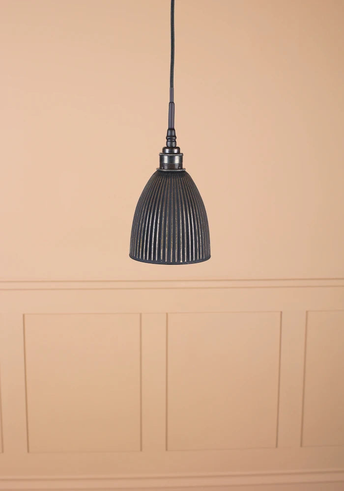 Small bell shaped black and gold ribbed  bathroom pendant light with antique bronze lamp holder and black fabric flex.