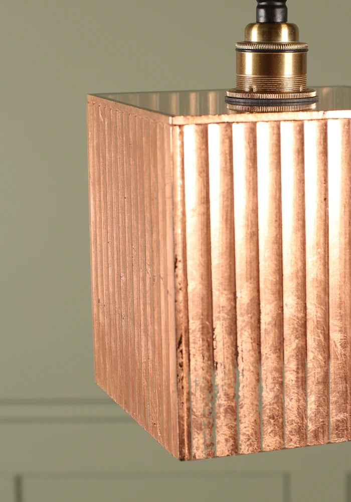 Close up large cube copper leaf bathroom pendant light.