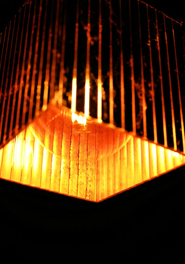 Close up large cube copper leaf bathroom pendant light.