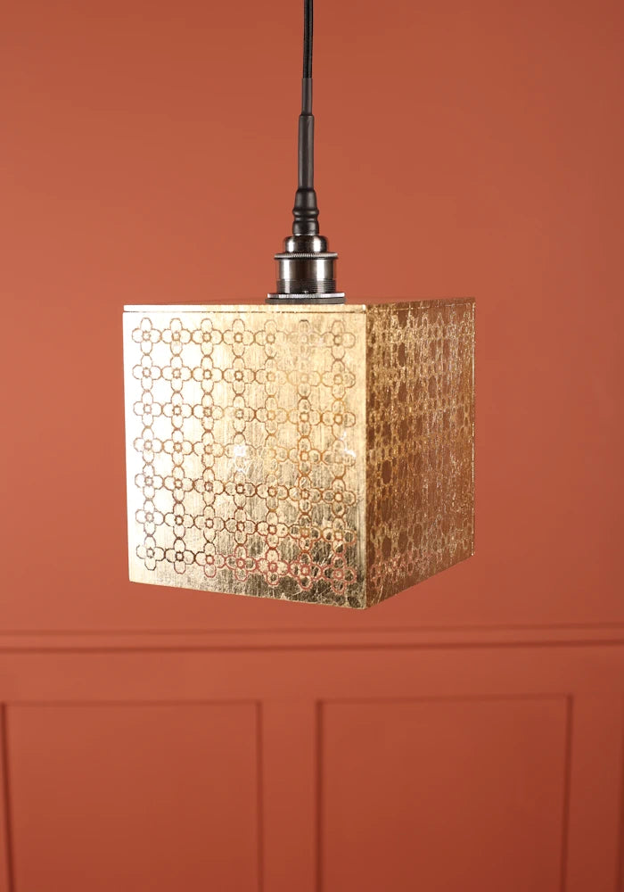 Large square Moroccan patterned gold bathroom with brushed nickel lamp holder.