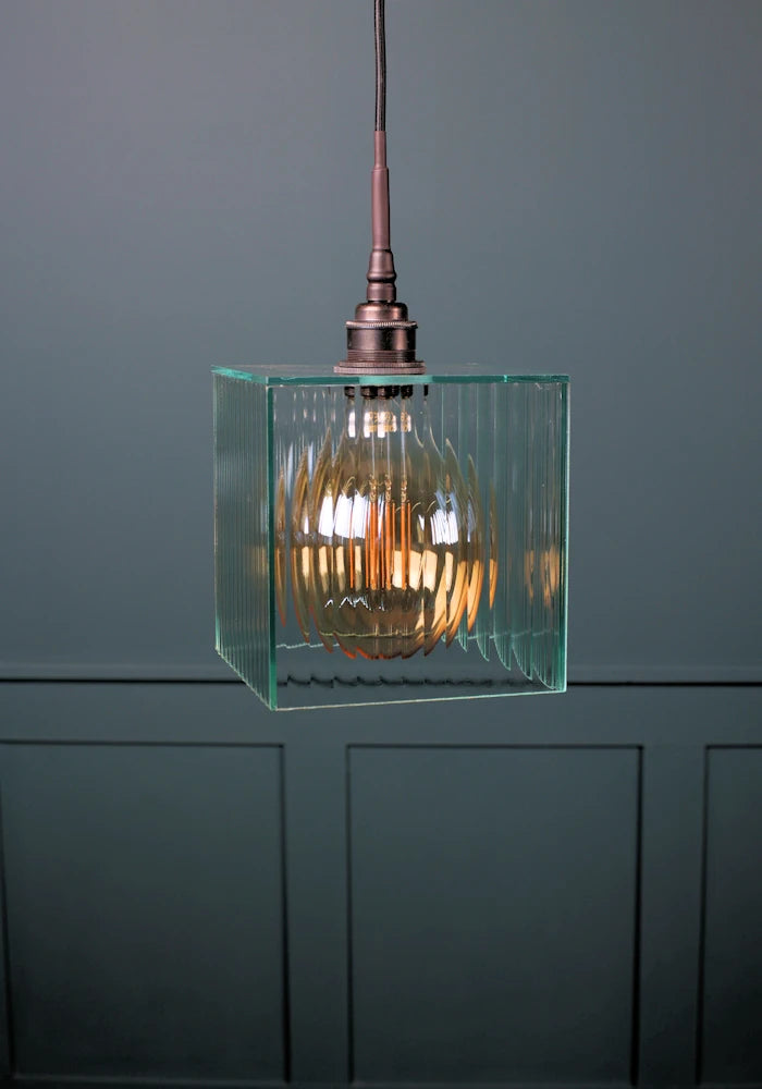 Square ribbed glass bathroom pendant light with antique bronze lamp holder. 