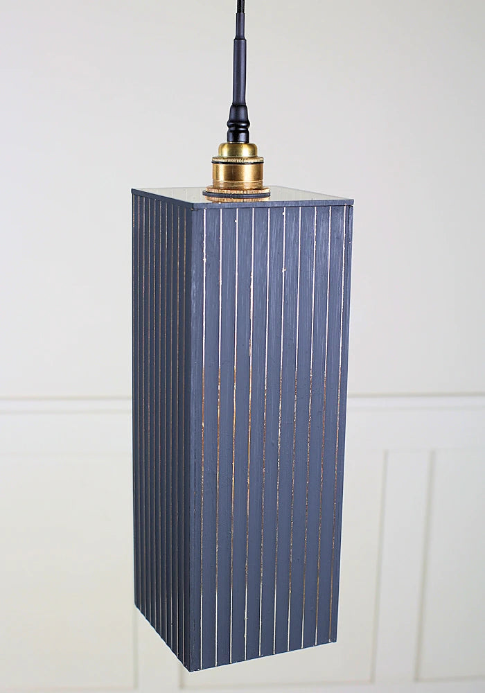 Large black and gold rectangular bathroom pendant light with brushed brass lamp holder.