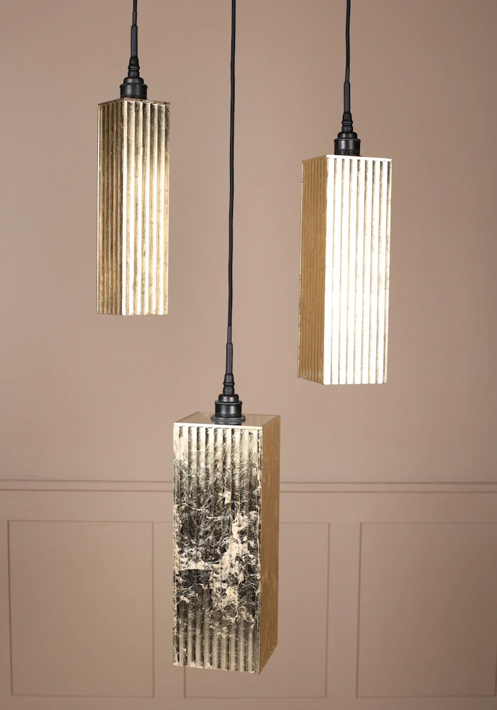 Triple gold leaf bathroom pendant light cluster light switched off.