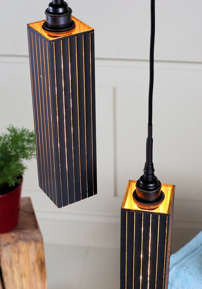 Close up black and gold cluster bathroom pendant light.