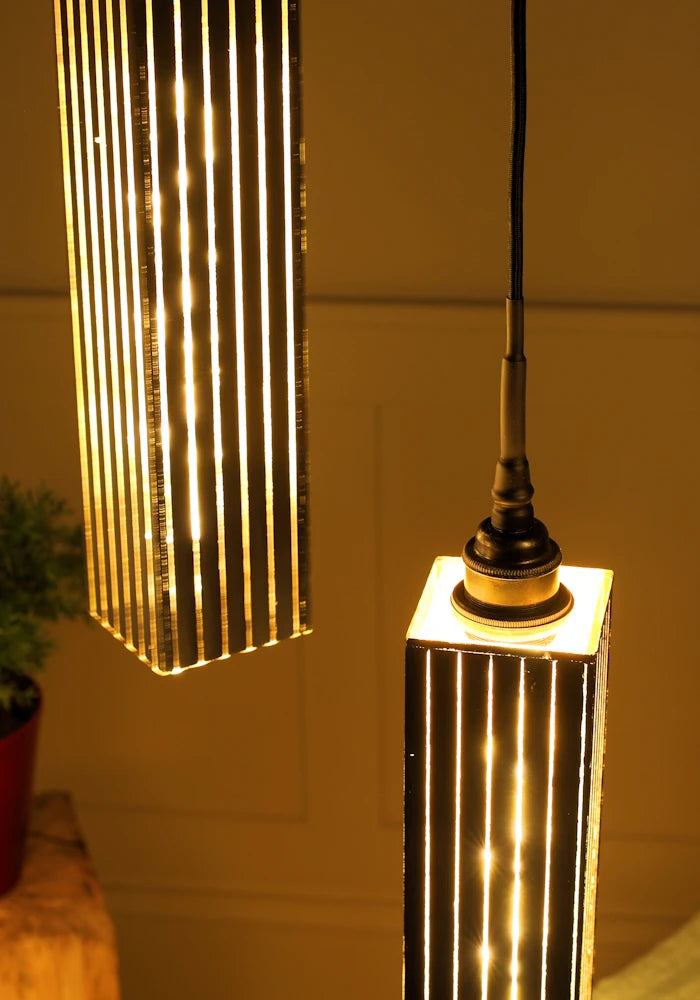 Close up two black and gold cluster bathroom pendant light.