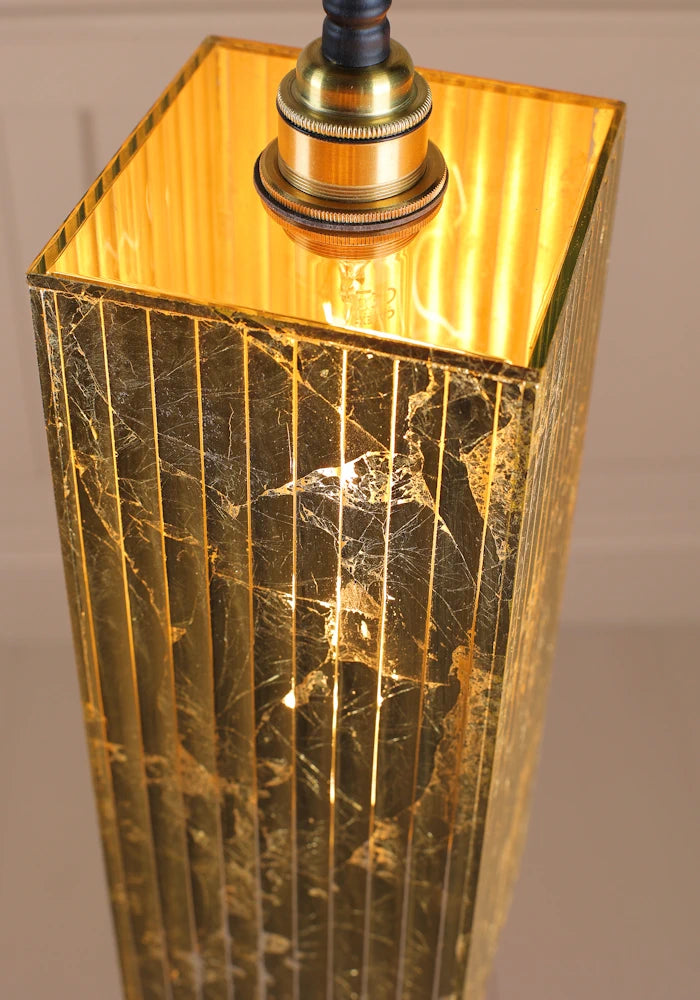 Close up large rectangular gold leaf bathroom pendant light.