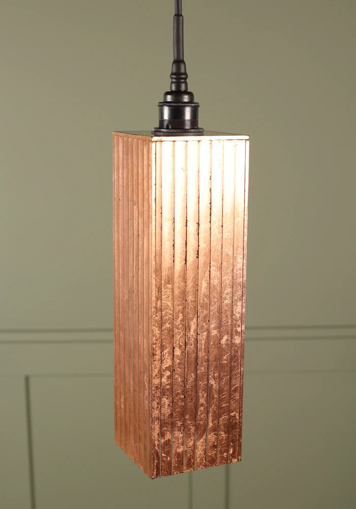 Elongated rectangular copper leaf bathroom pendant light with antique bronze lamp holder.