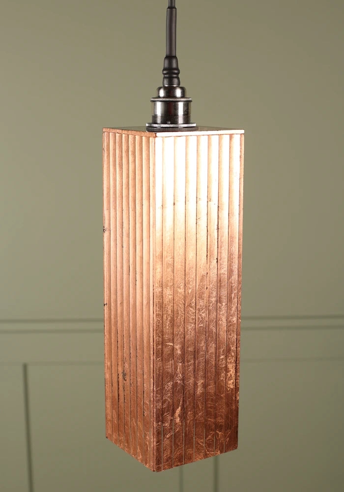 Elongated rectangular copper leaf bathroom pendant light with brushed nickel lamp holder.