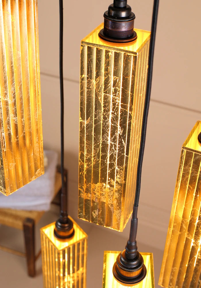 Close up image 5 gold leaf bathroom pendant light cluster.