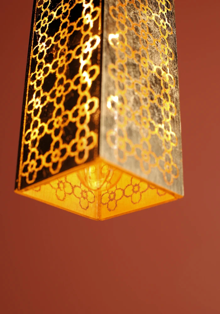 Close up of elongated rectangular Moroccan style bathroom pendant light.