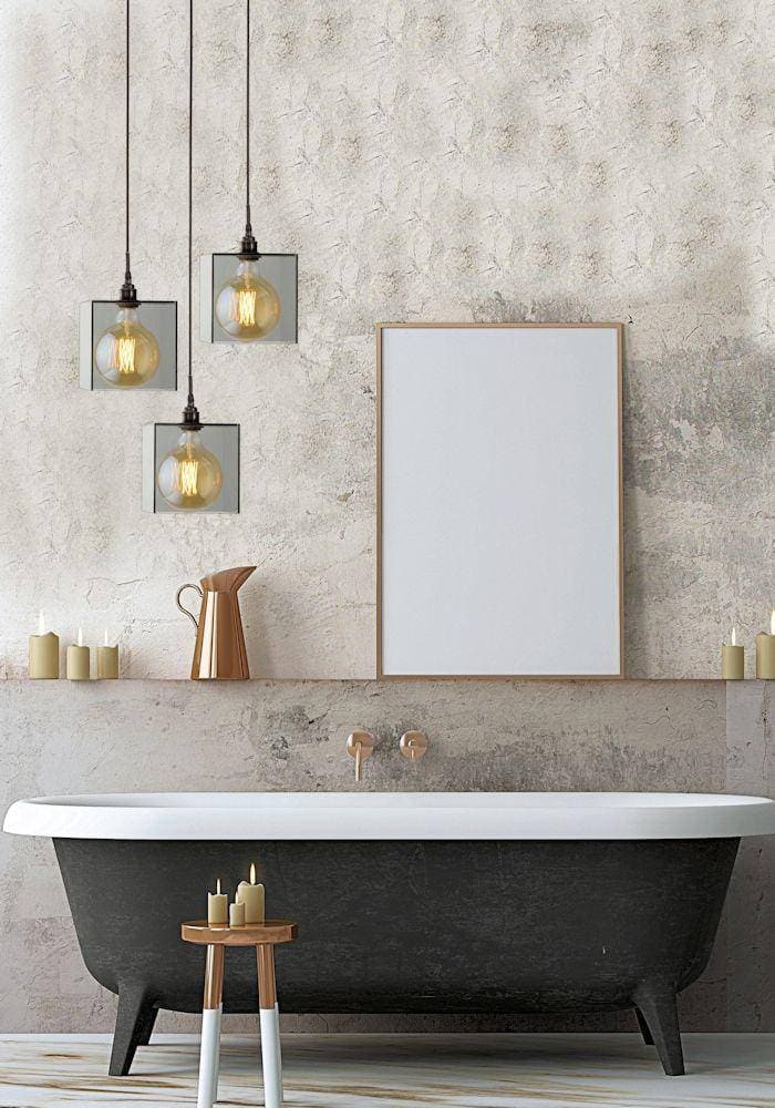 Three large square smoked glass bathroom pendant lights hanging over bath.